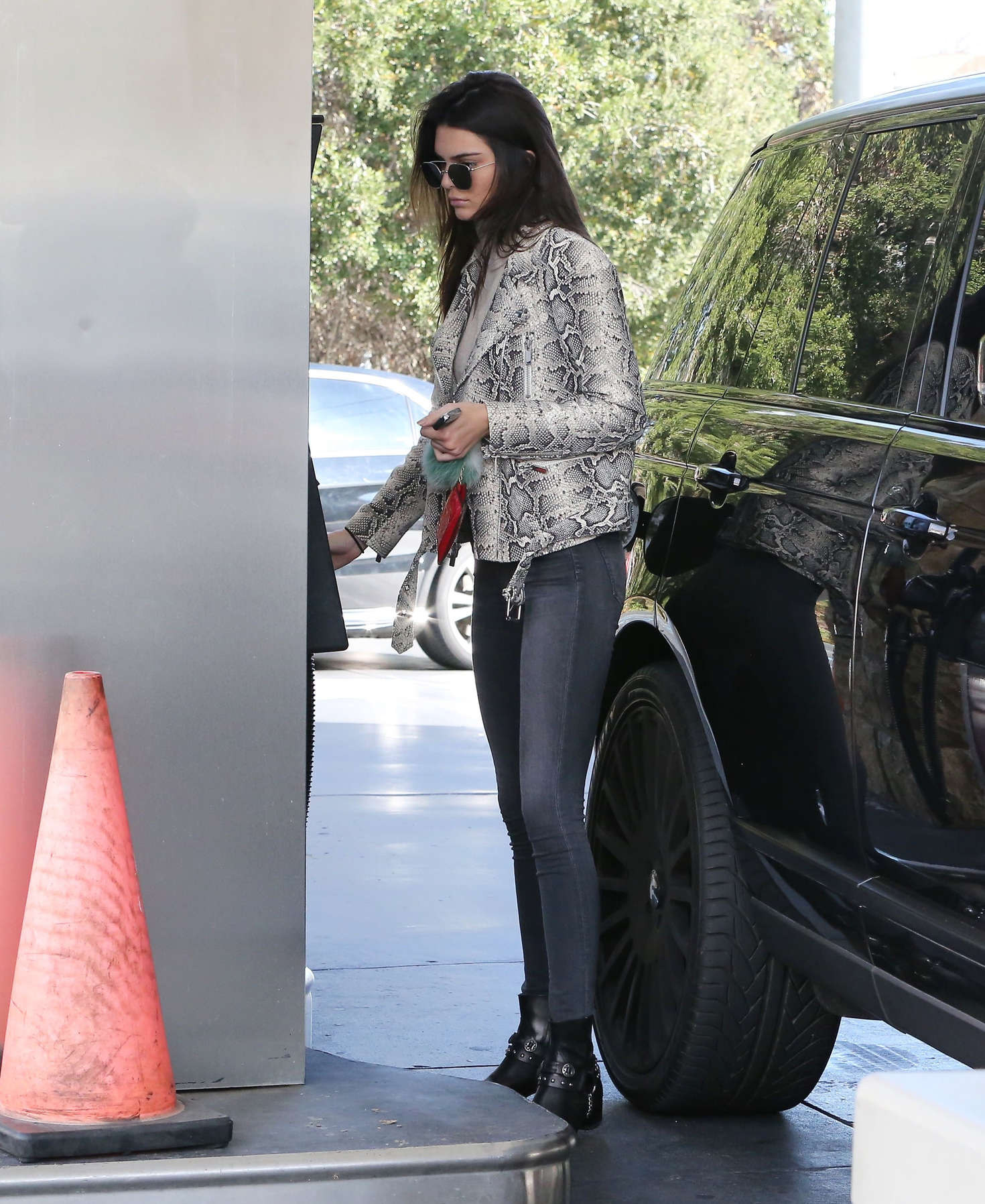 Kendall Jenner pumping gas 16