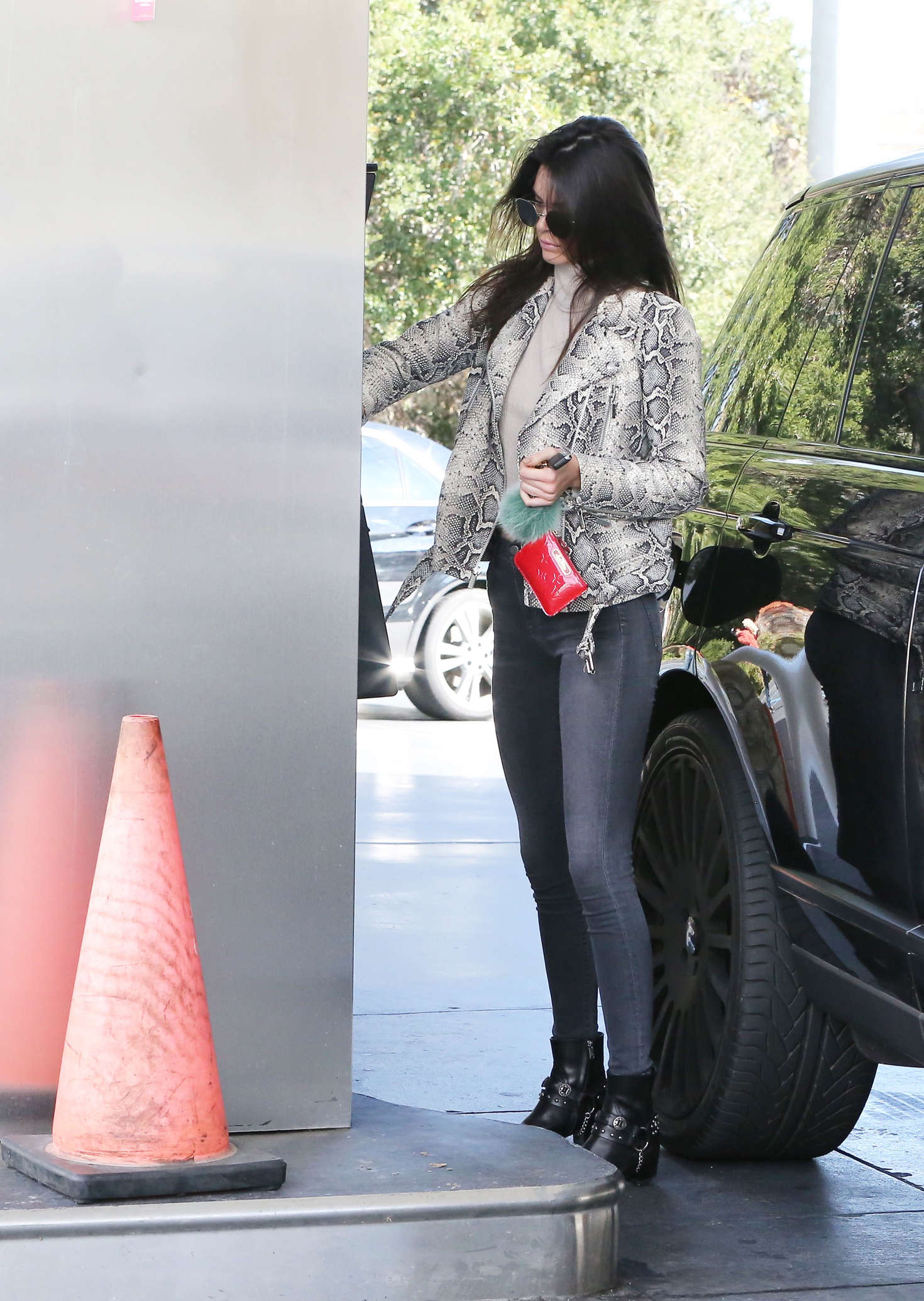 Kendall Jenner pumping gas 17