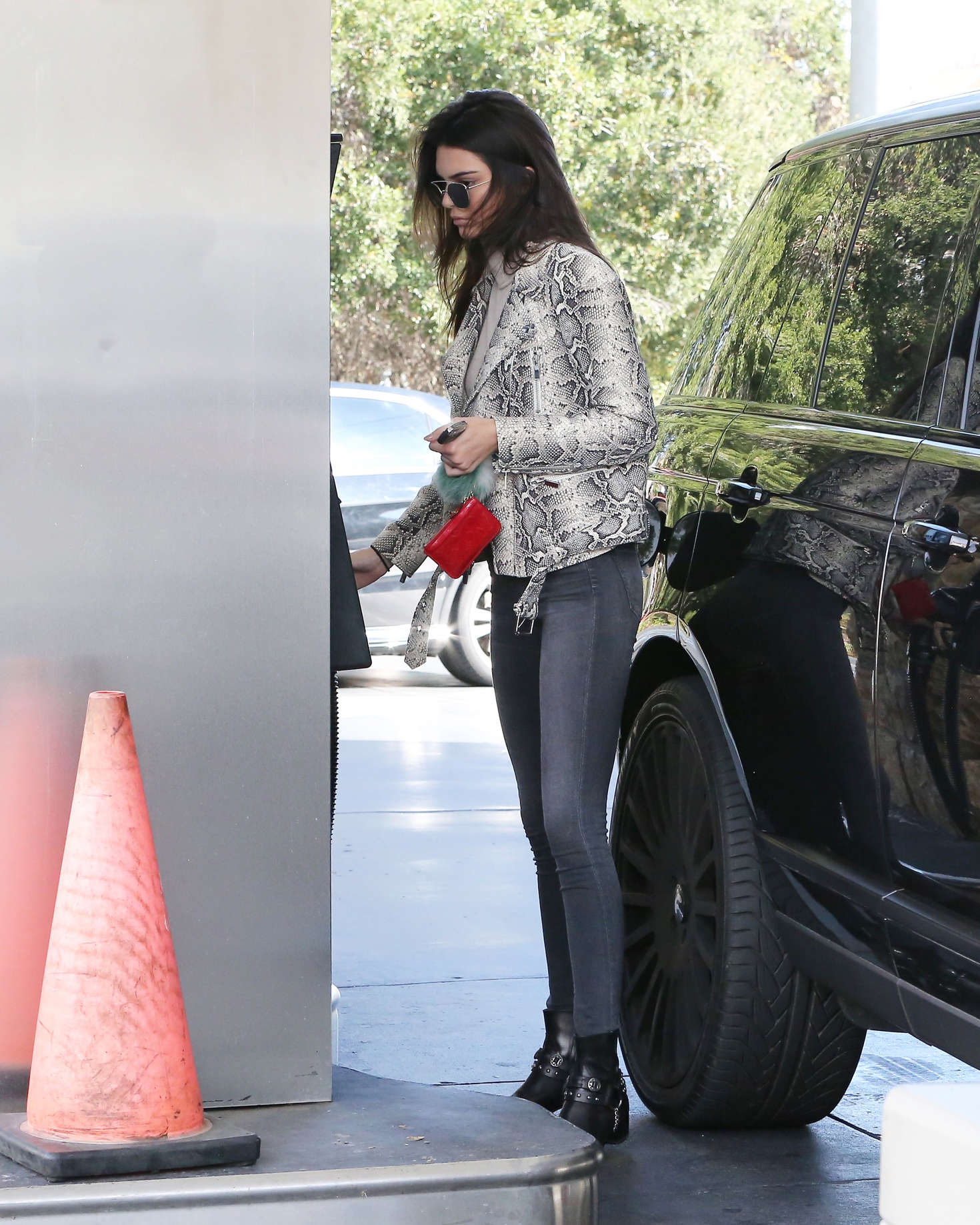 Kendall Jenner pumping gas 30
