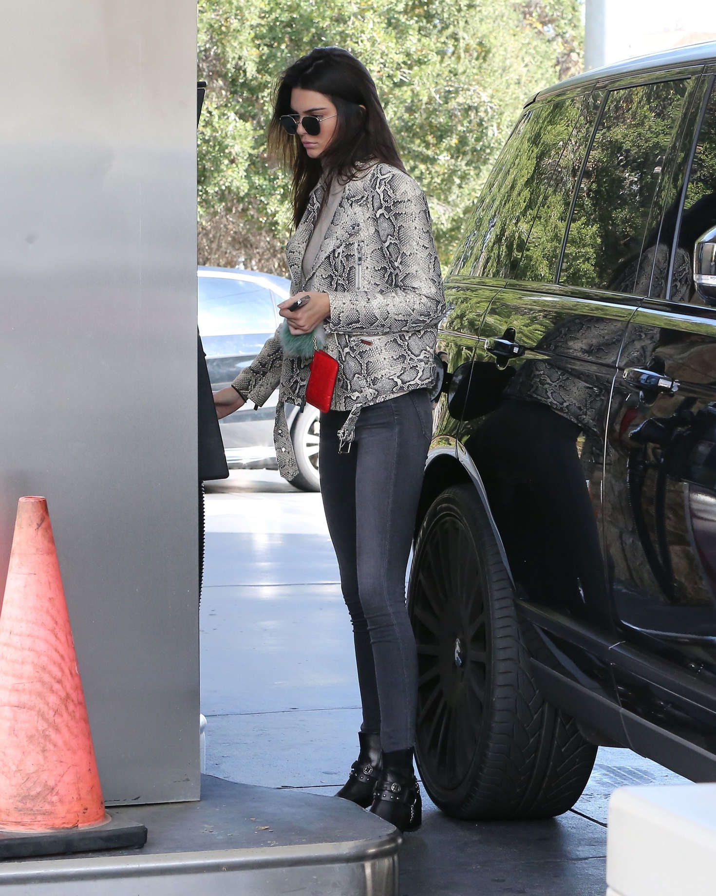 Kendall Jenner pumping gas 36