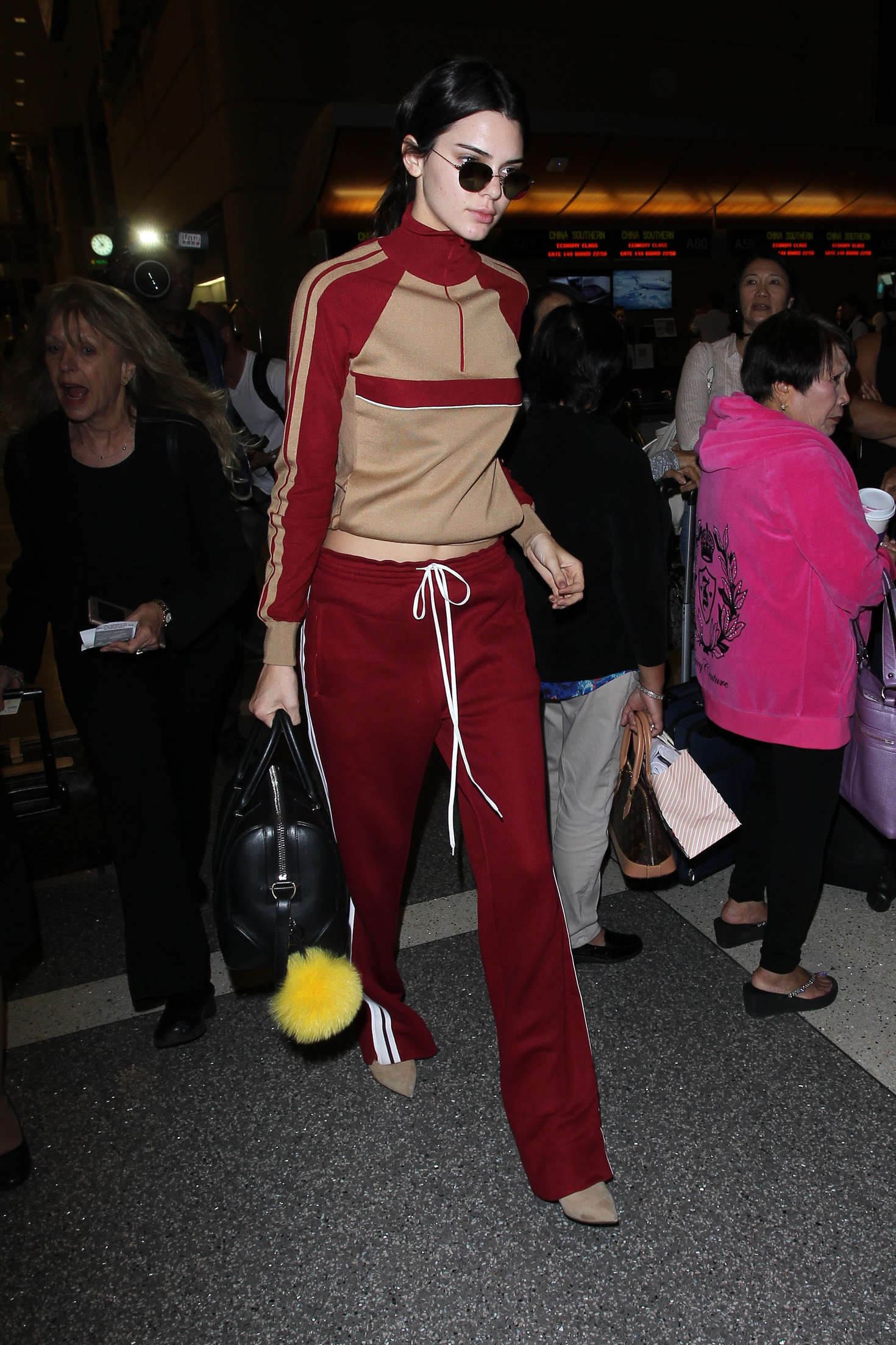 Kendall Jenner in Red Sweats at LAX 01