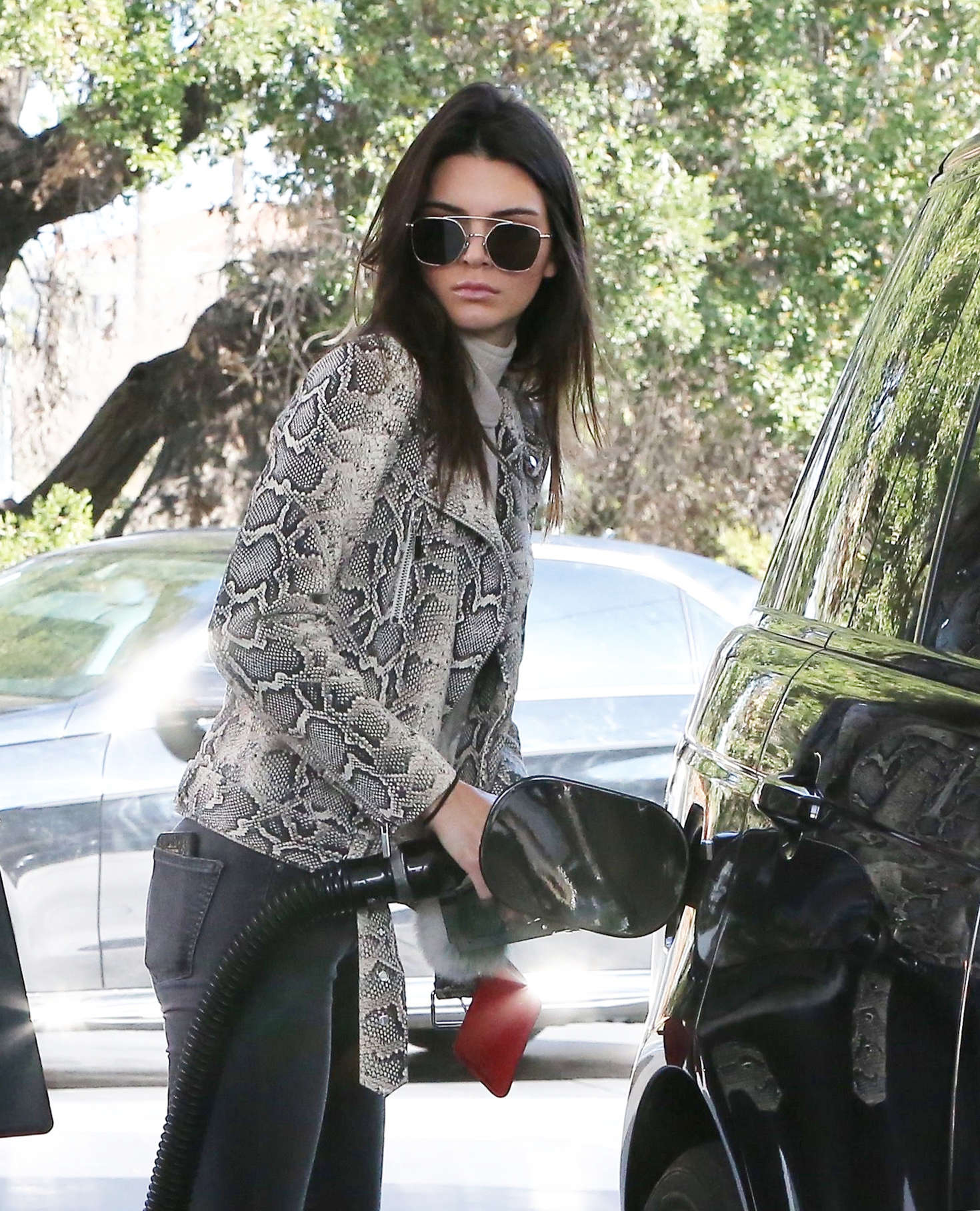 Kendall Jenner pumping gas 18