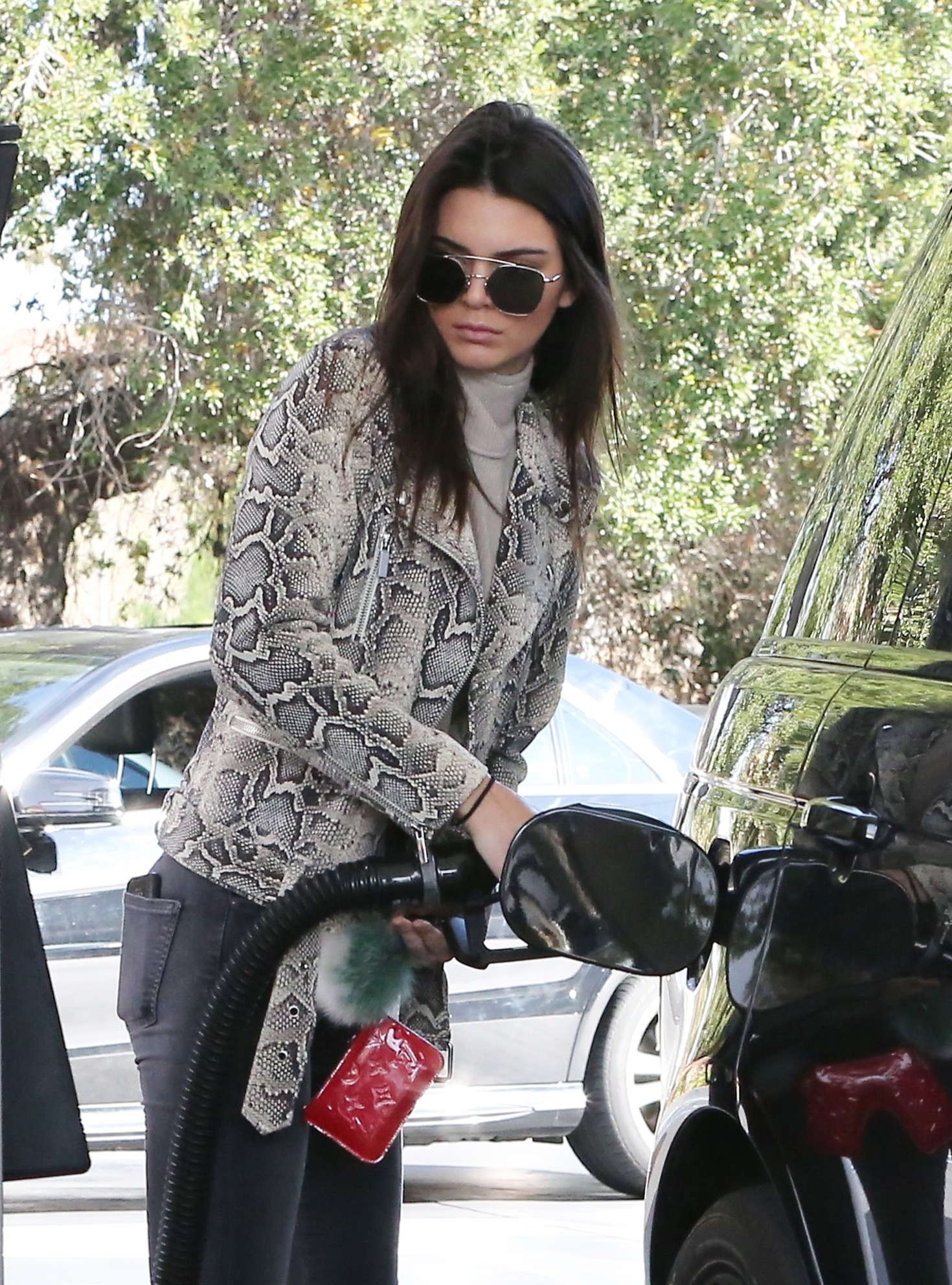 Kendall Jenner pumping gas 08