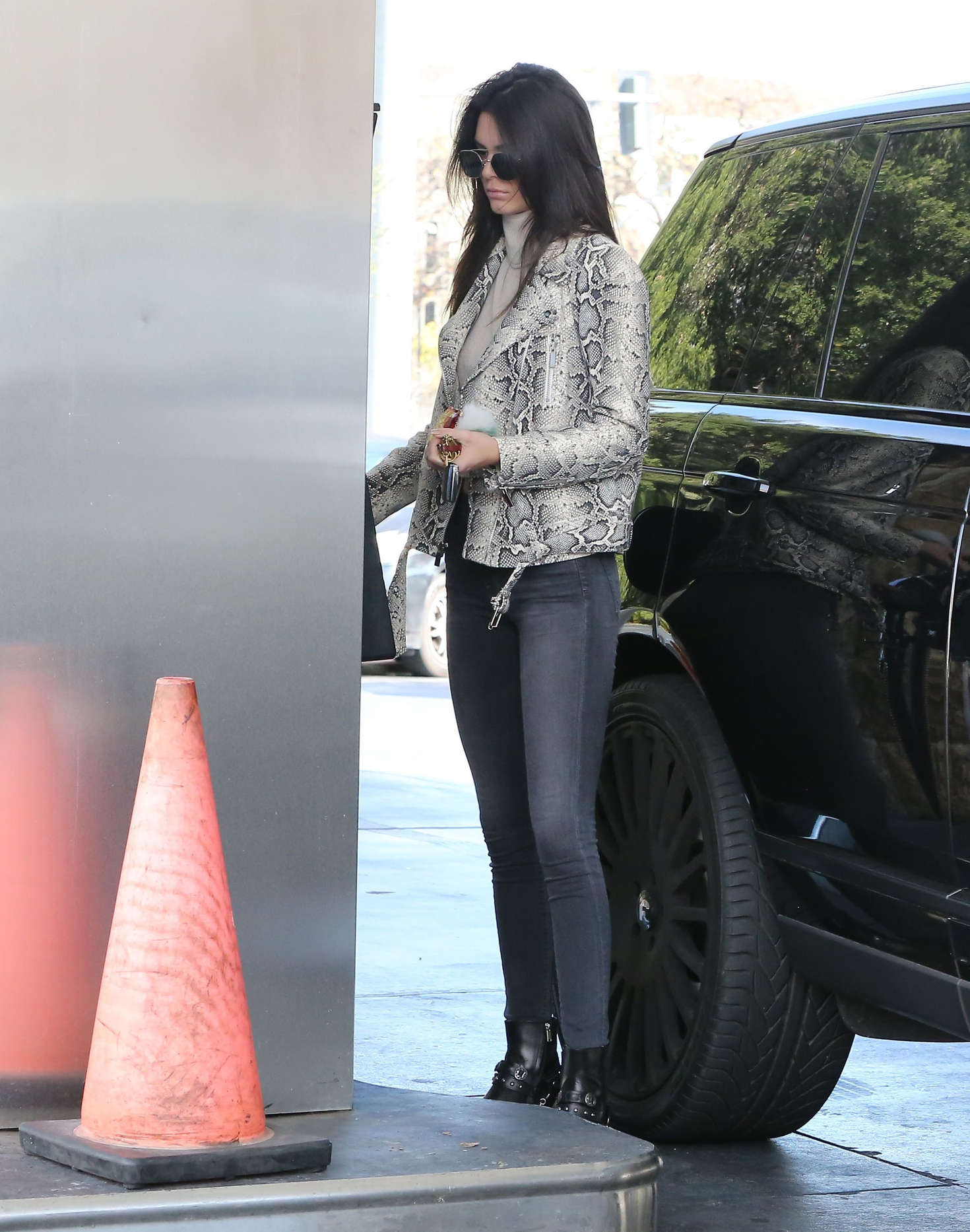 Kendall Jenner pumping gas 34