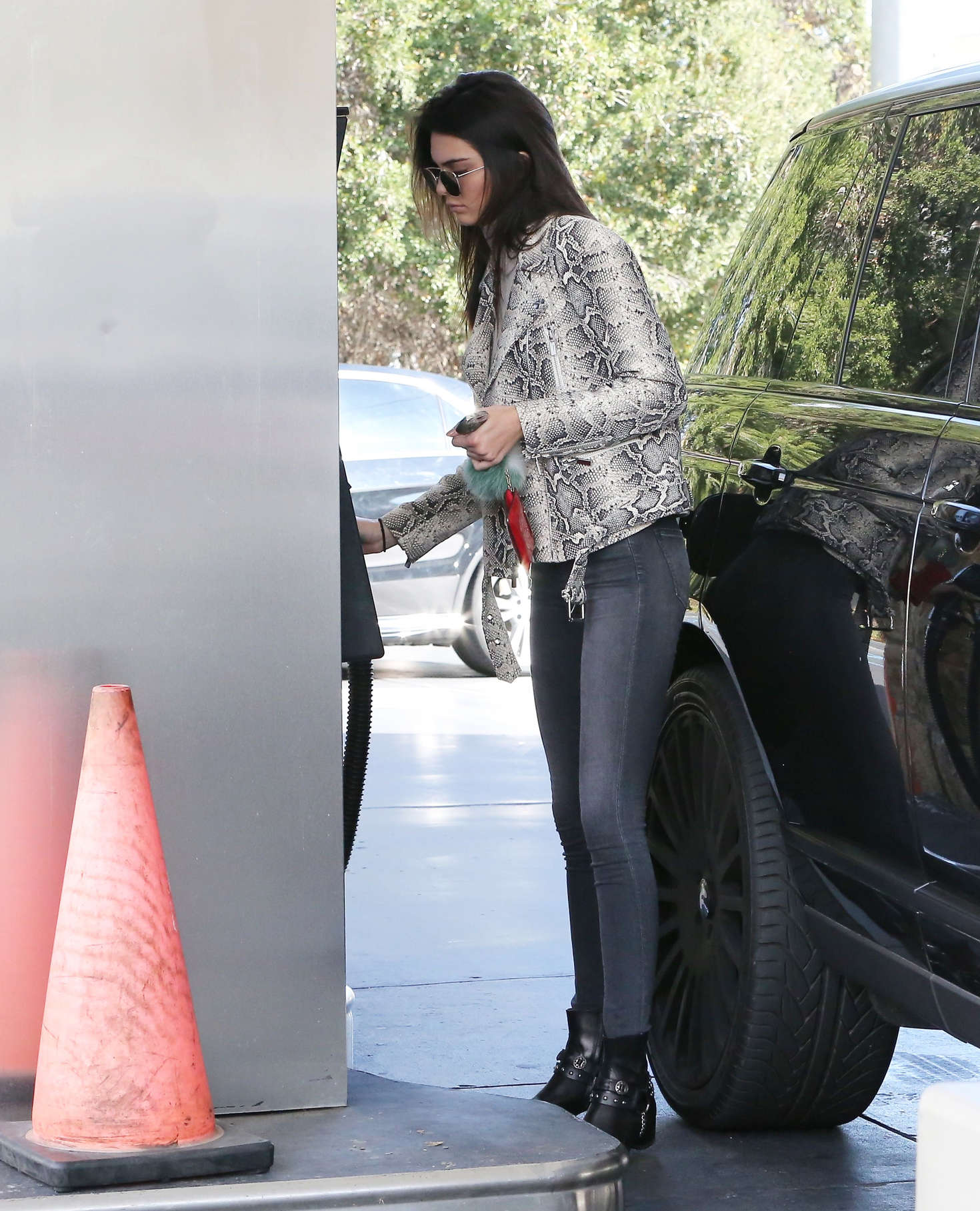 Kendall Jenner pumping gas 07