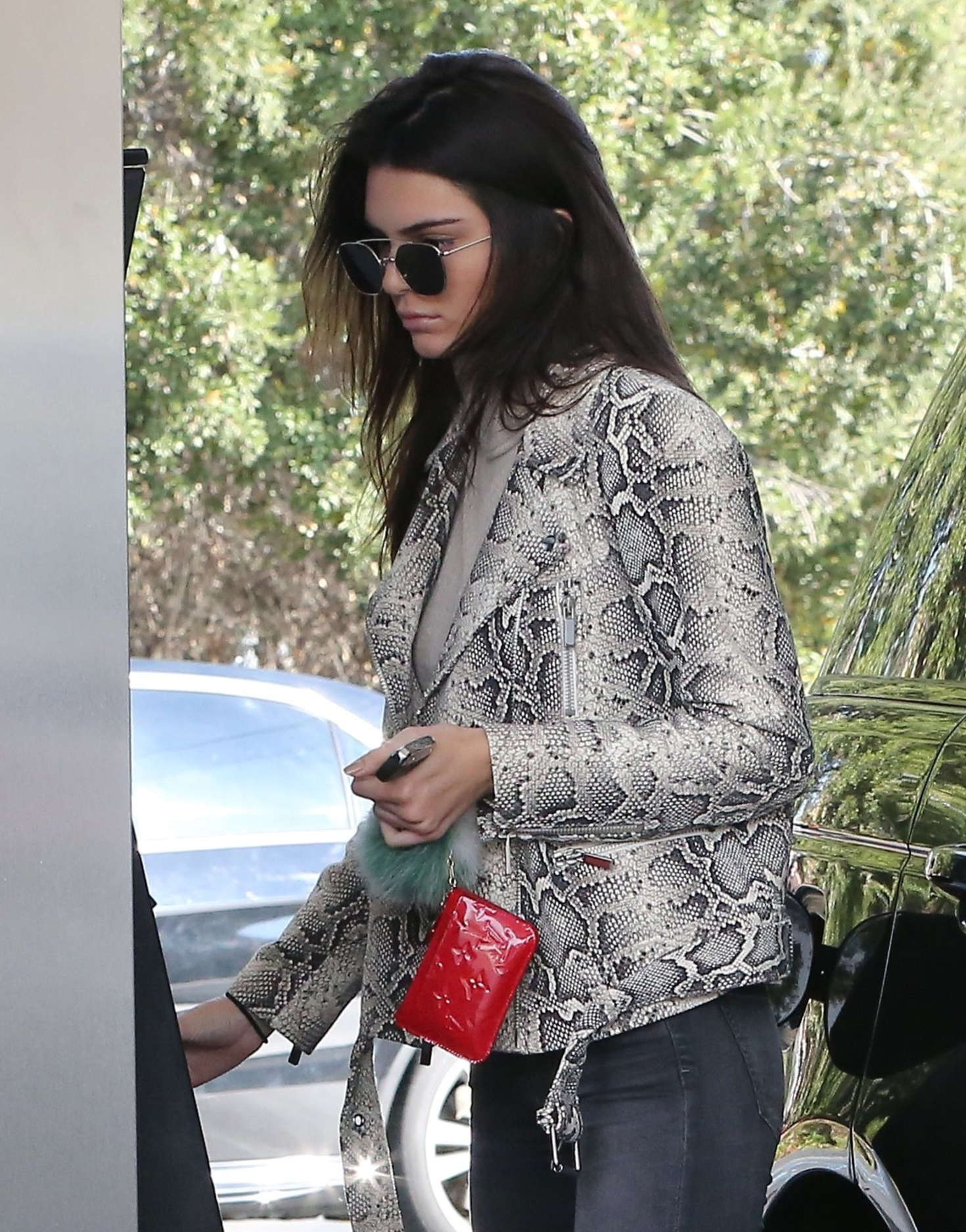 Kendall Jenner pumping gas 09