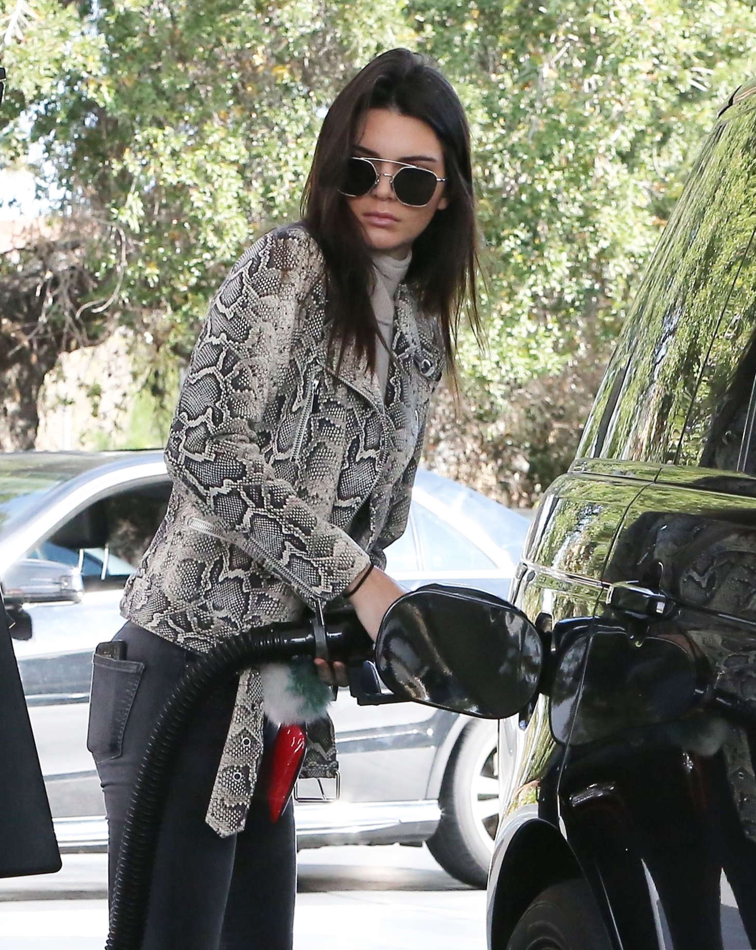 Kendall Jenner pumping gas 10